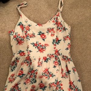 A cream and floral printed sun dress